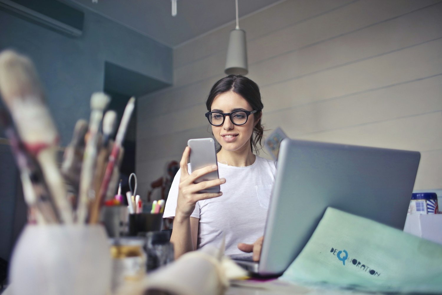 A woman working at a bright desk